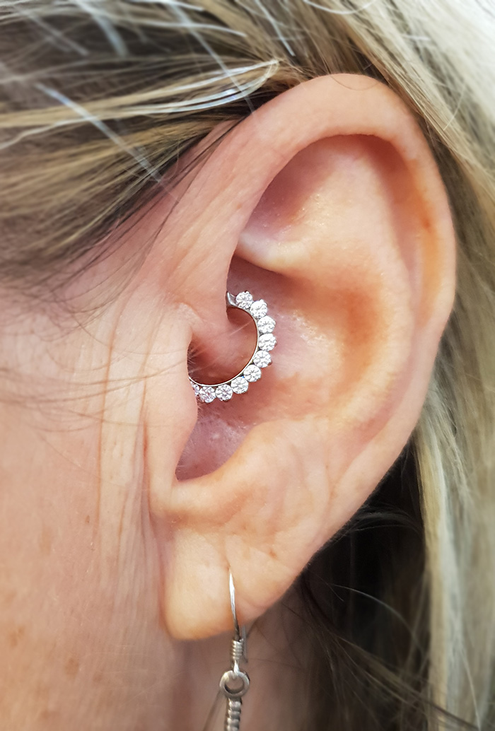 a healed daith piercing wearing the oddesy clicker from Industrial Strength
