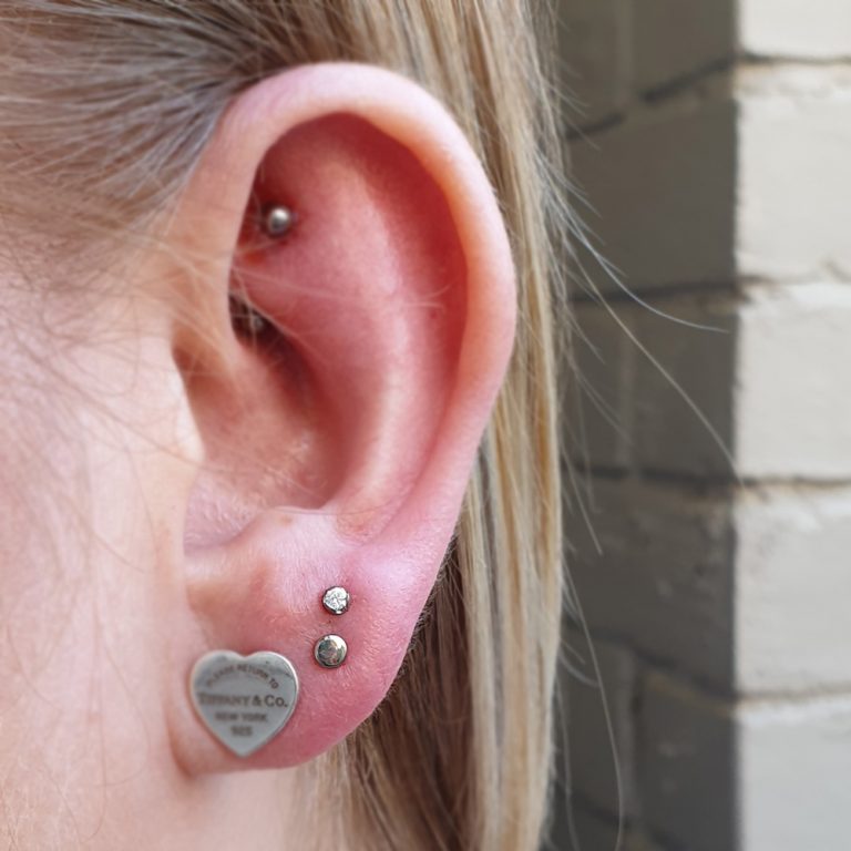 stacked lobe piercings with a Tiffanies earring