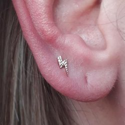 a hammered lightning bolt shape from Anatometal in a lobe piercing